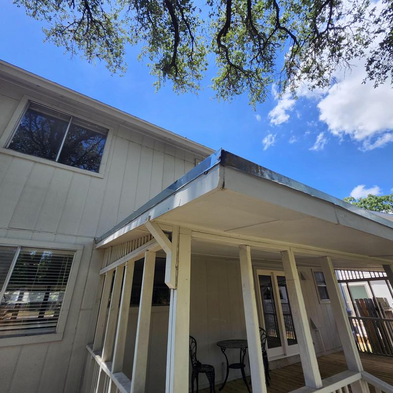 Galvanized drip edge flashing on porch roof edge