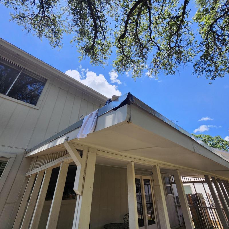 Galvanized drip edge flashing repair on porch roof
