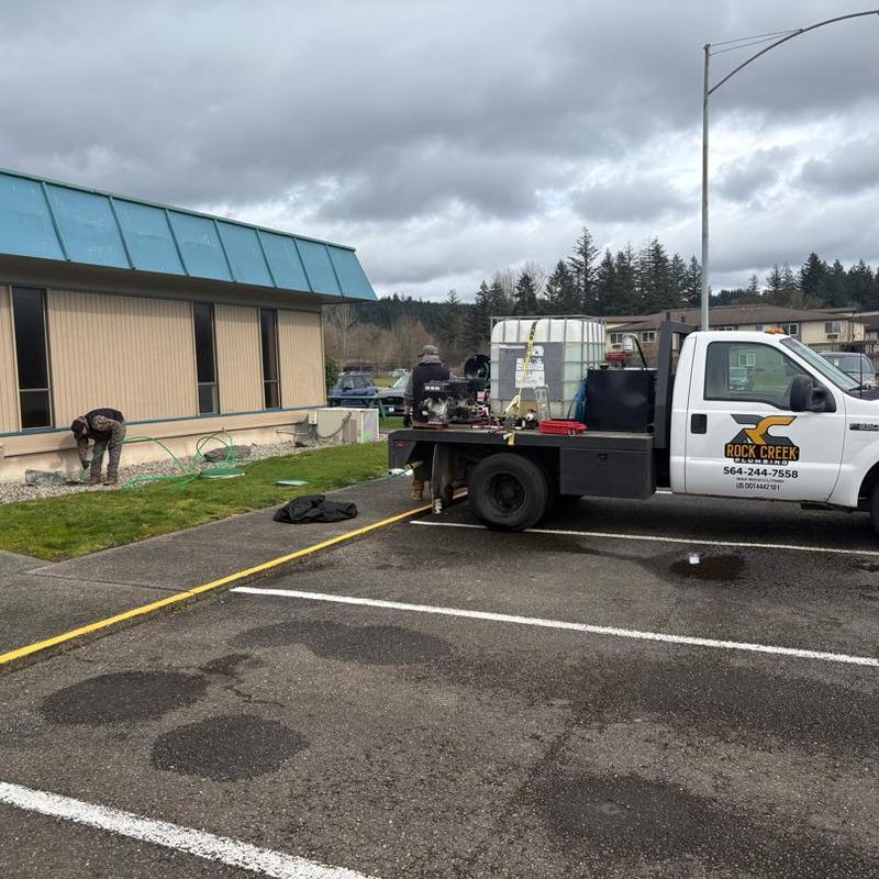 Main line jetter setup with service truck and operators