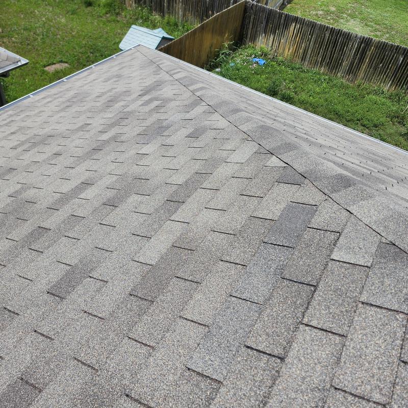 Weather-gray six-meter roof shingles installation and sealing