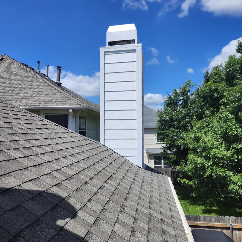 Hardie Board chimney siding and trim with roofing shingles