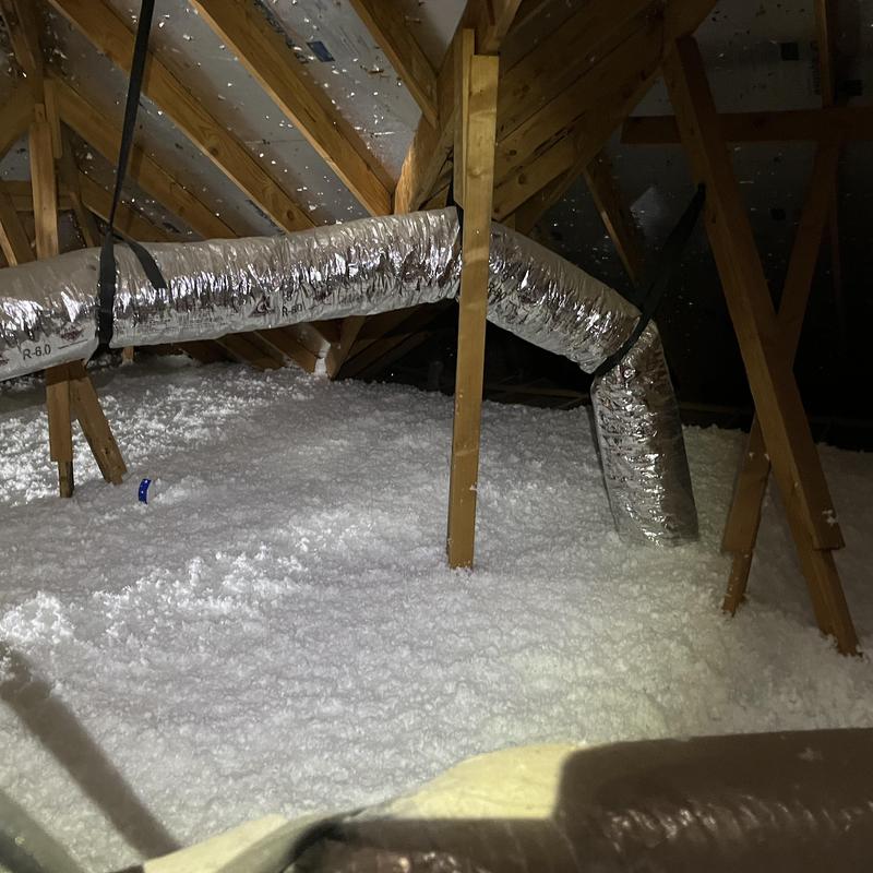 Attic loose-fill insulation with HVAC ductwork