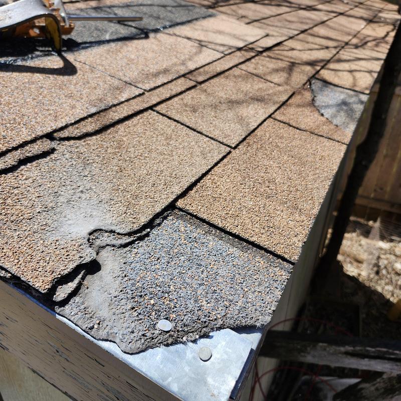 Storage shed roof shingles with weathered edges