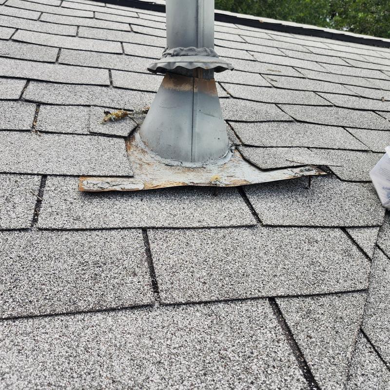 Lead plumbing boot on shingle roof with damaged flashing