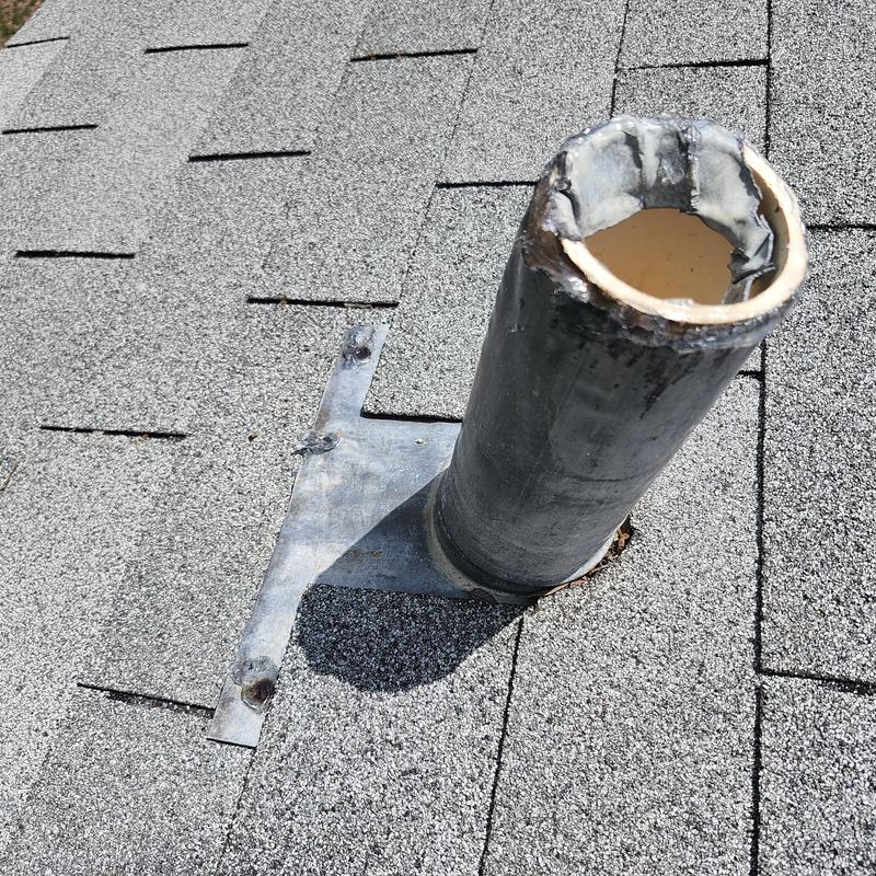 Lead plumbing boot on shingled roof with sealing gaps