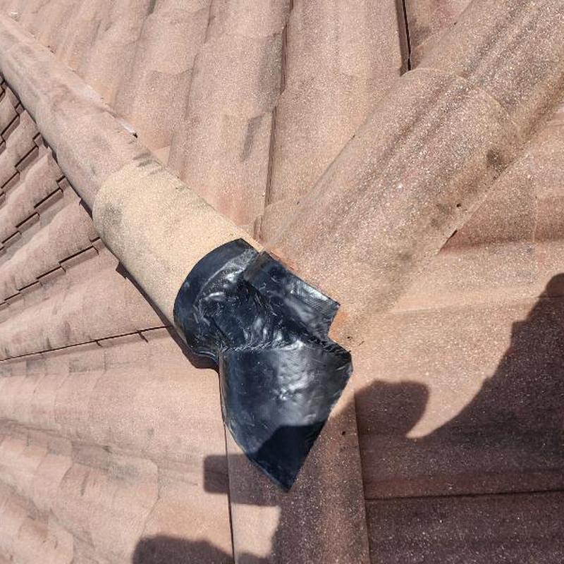 Clay barrel terracotta roof tiles with ridge repair detail Clay barrel terracotta roof tiles with ridge repair detail