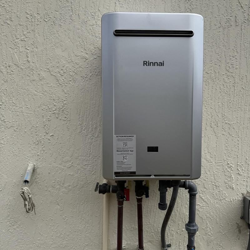 Rinnai RE199 tankless water heater installation on wall