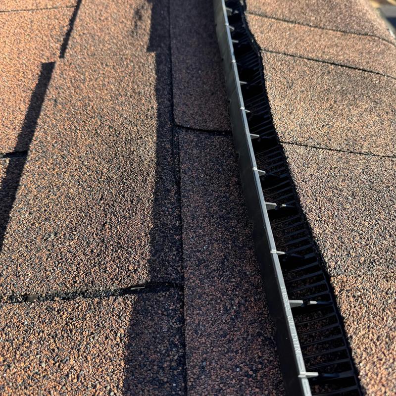 Asphalt shingle roof with ridge vent installation Asphalt shingle roof with ridge vent installation