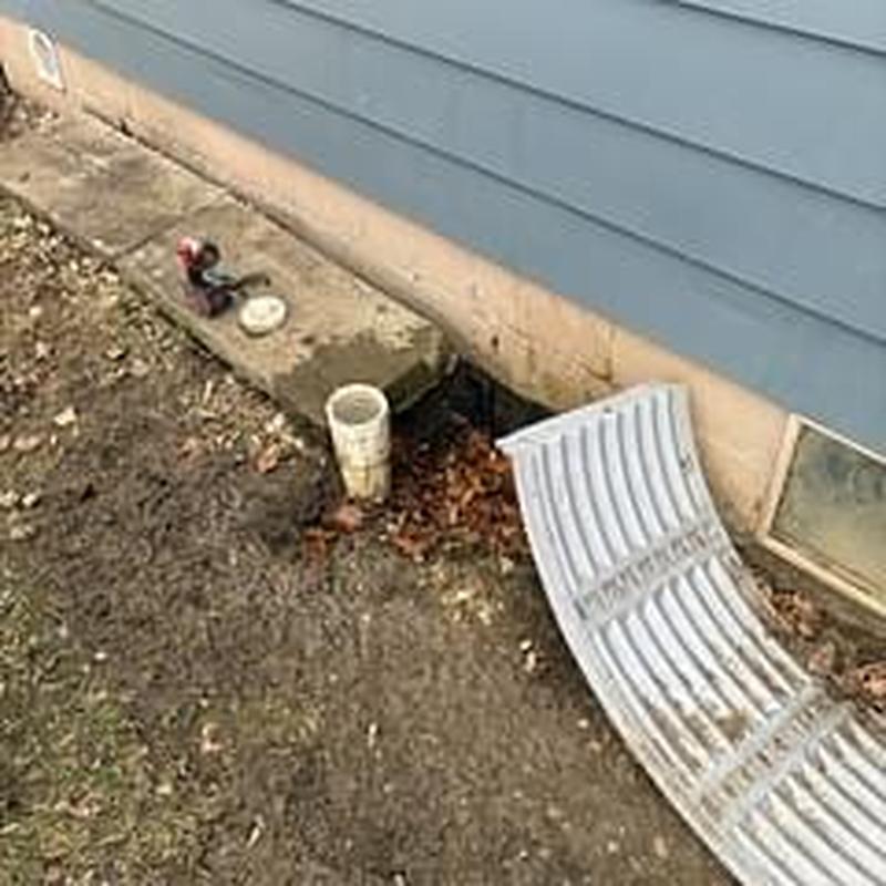 Main sewer cleanout pipe with easy access near foundation