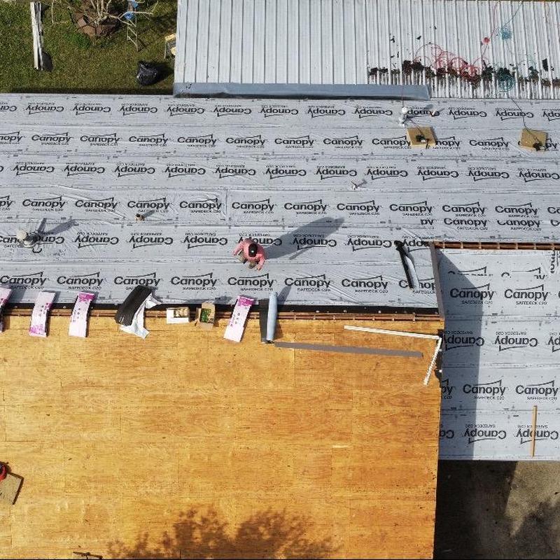 Roof decking installation with synthetic underlayment