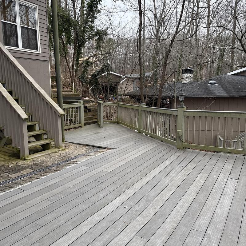 Wooden staircase and deck with damaged joists outdoors