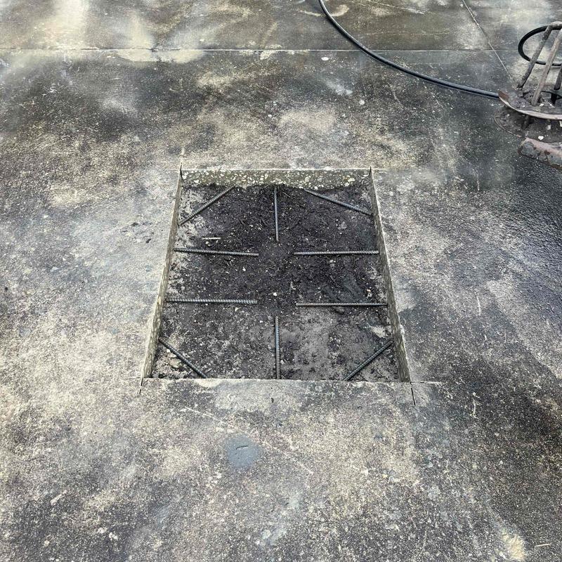 Concrete driveway cutout with rebar for pipe repair Concrete driveway cutout with rebar for pipe repair
