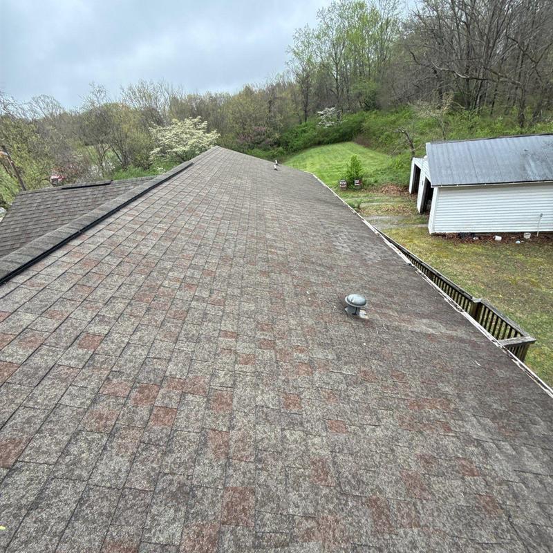 Asphalt shingle roof with hail damage inspection