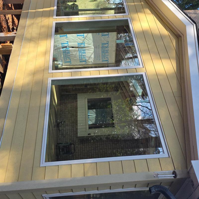 Sunroom double-pane windows with HardiePlank siding