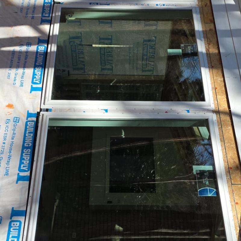 Vinyl window installation on sunroom addition