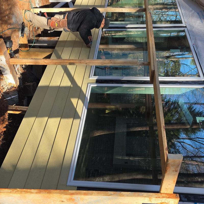 HardiePlank siding installation on sunroom addition