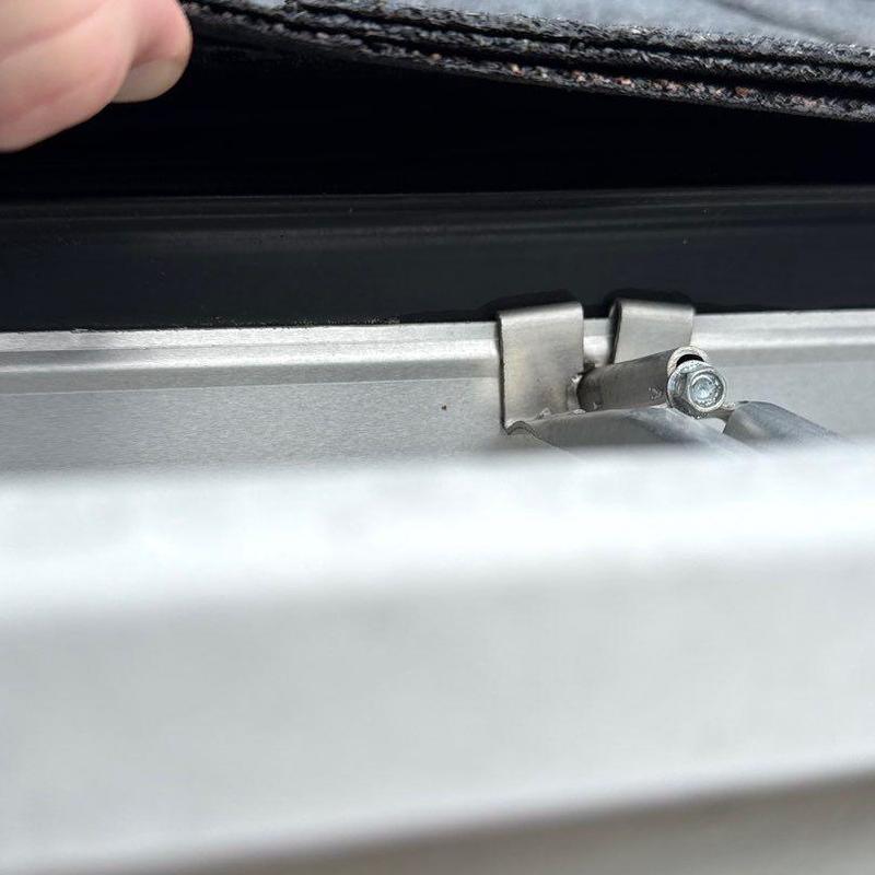 Metal roof clip attached under roofing material