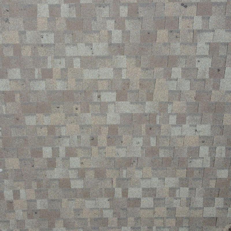 Asphalt shingle roof with hail damage marks Asphalt shingle roof with hail damage marks