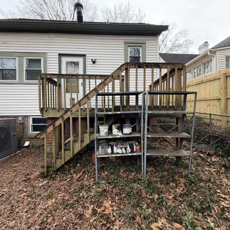 Wooden deck with stairs and storage shelves