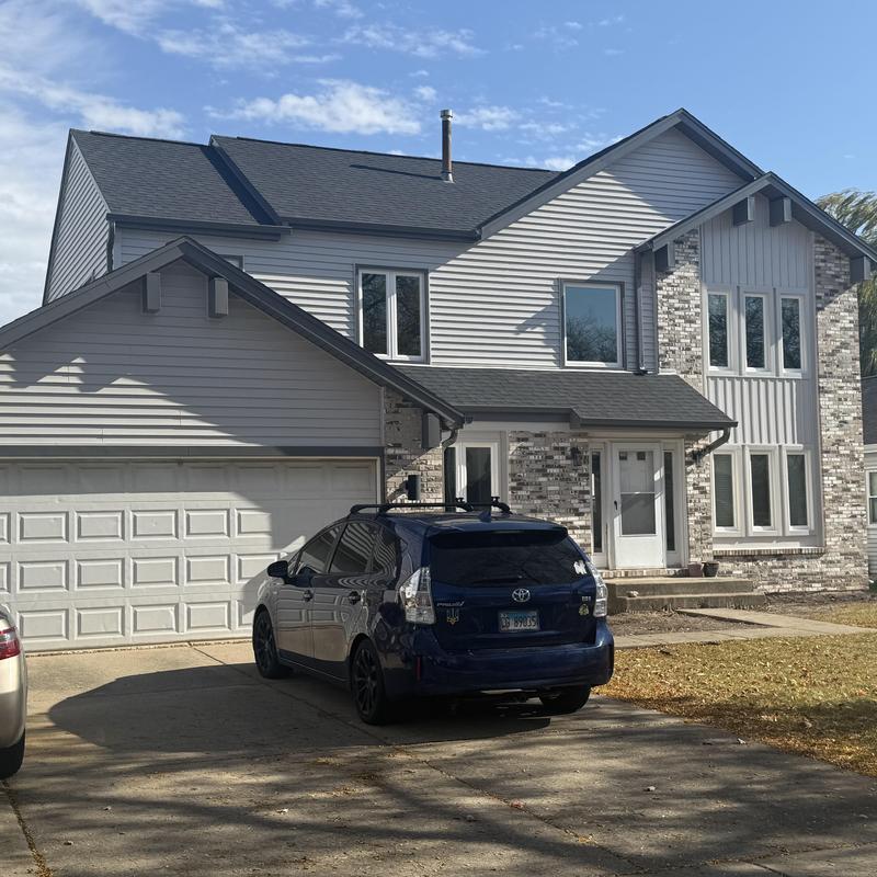 Atlas impact class 4 roof with vinyl siding and gutters