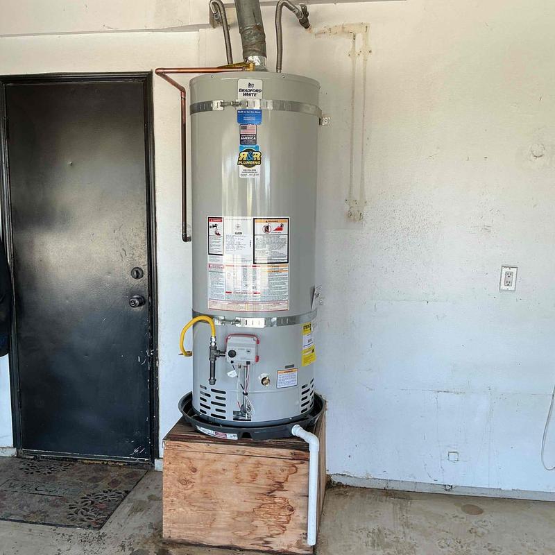 Bradford White propane water heater with piping