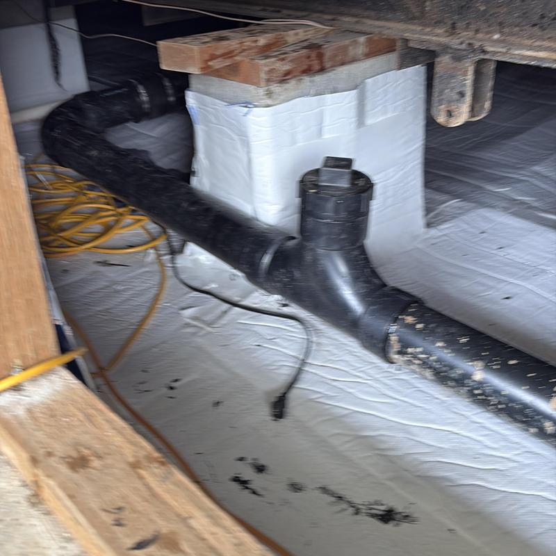 Sewer main with two-way cleanout installation in crawl space