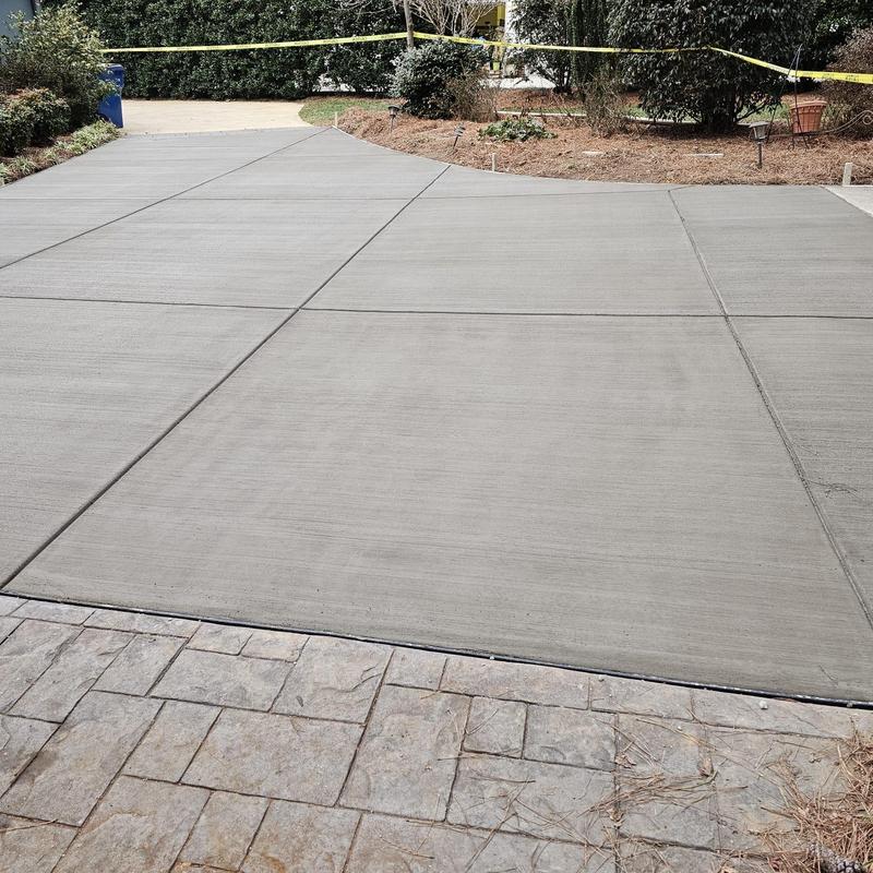 Concrete driveway with fresh expansion joints and broom finish
