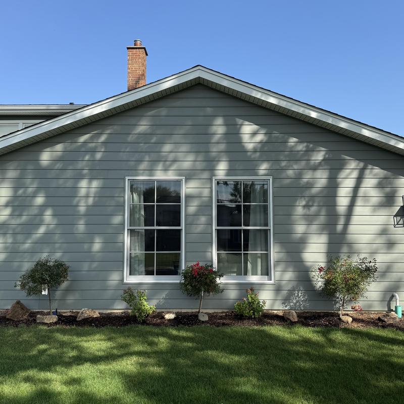 Composite insulated siding on house exterior wall