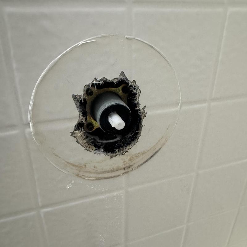 Delta shower cartridge with calcium buildup in tile wall