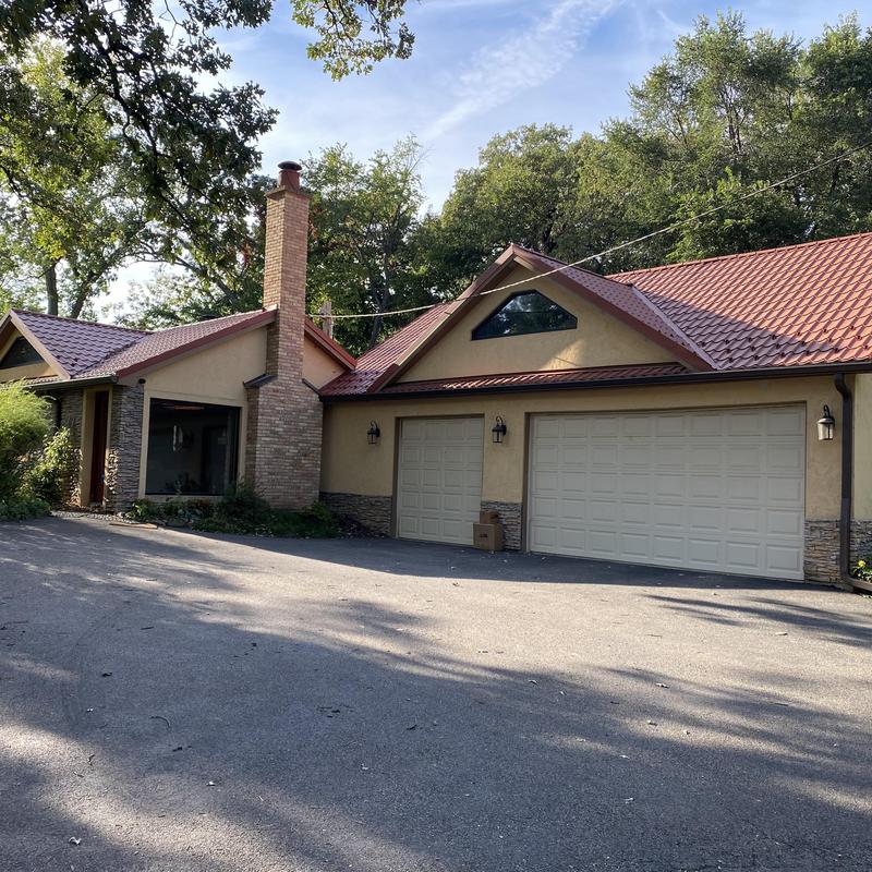 Gutters and gutter guards on residential home exterior