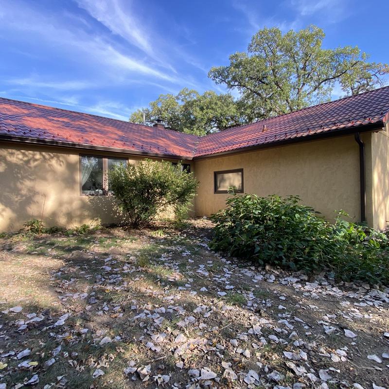 Gutters and gutter guards on residential home exterior
