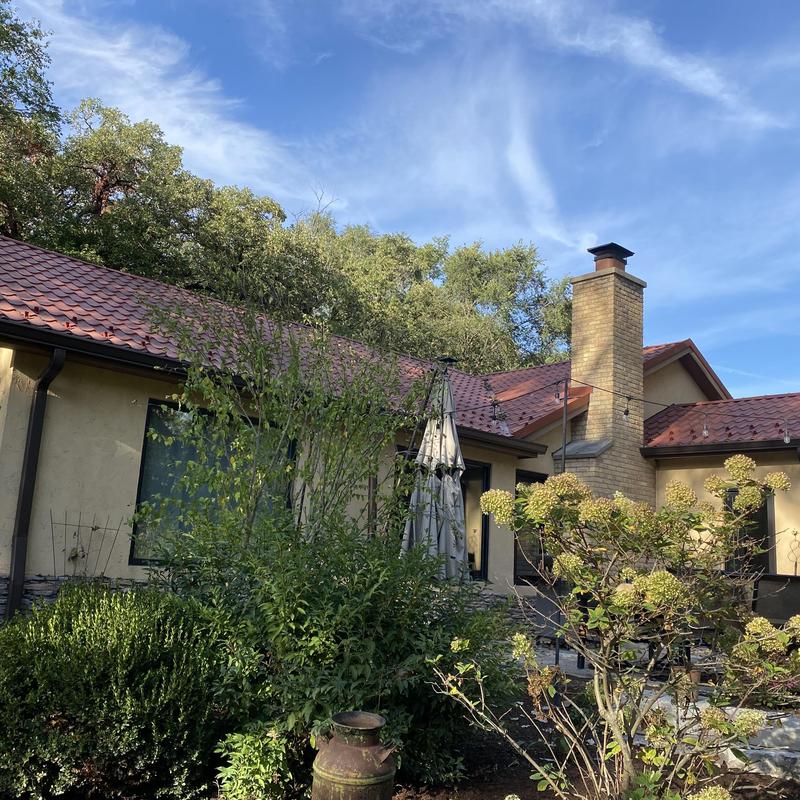 Gutters with guards installed on residential roof