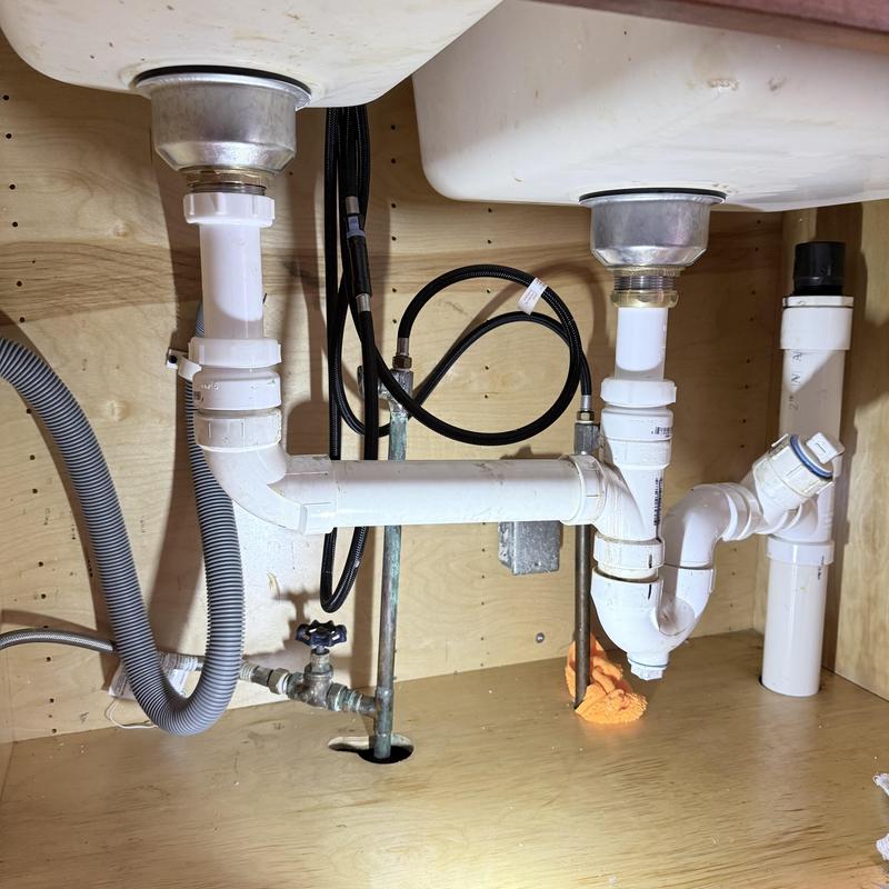 Sink drain pipes and fittings under dual basins Sink drain pipes and fittings under dual basins