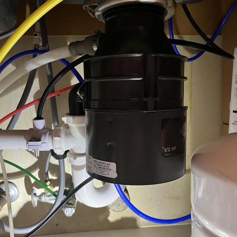 Garbage disposal unit installation under sink