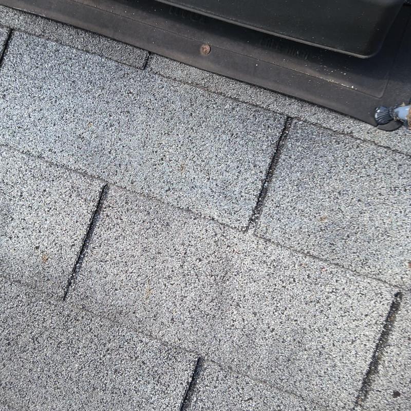 Field shingles with pipe boot and ridge cap details