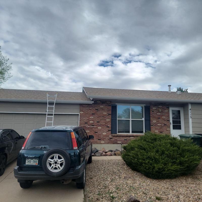 Shingle roof hail damage inspection with ladder setup Shingle roof hail damage inspection with ladder setup