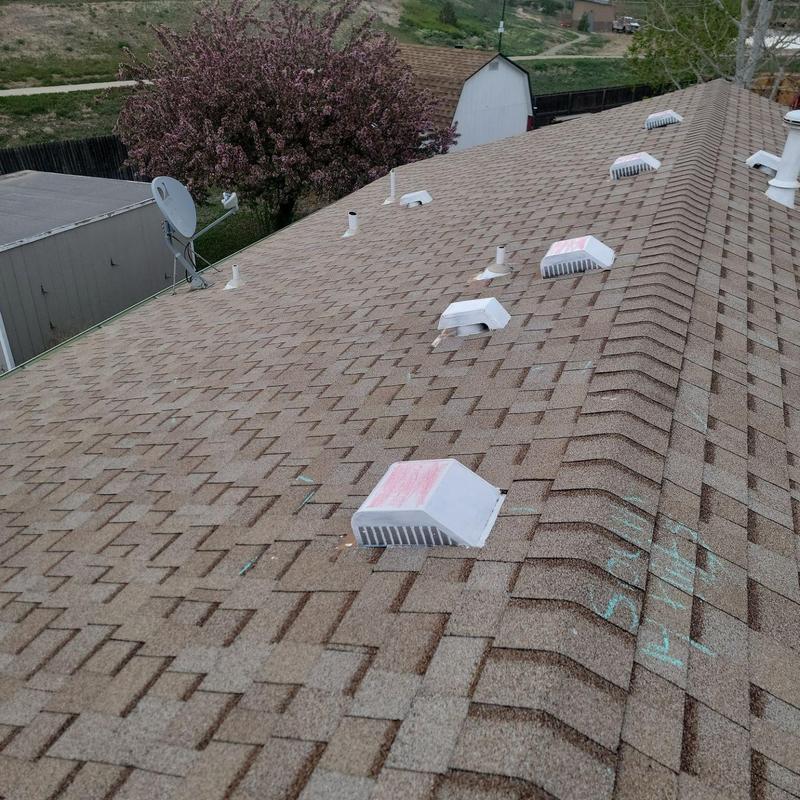 Shingle roof with hail damage markings and vents Shingle roof with hail damage markings and vents