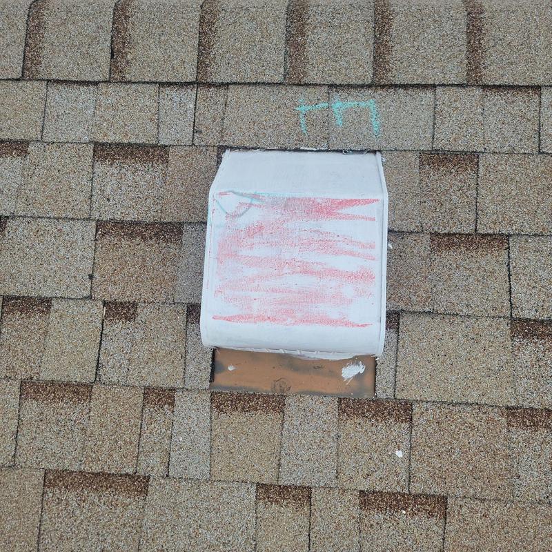 Shingle roof vent with chalk markings and damage Shingle roof vent with chalk markings and damage