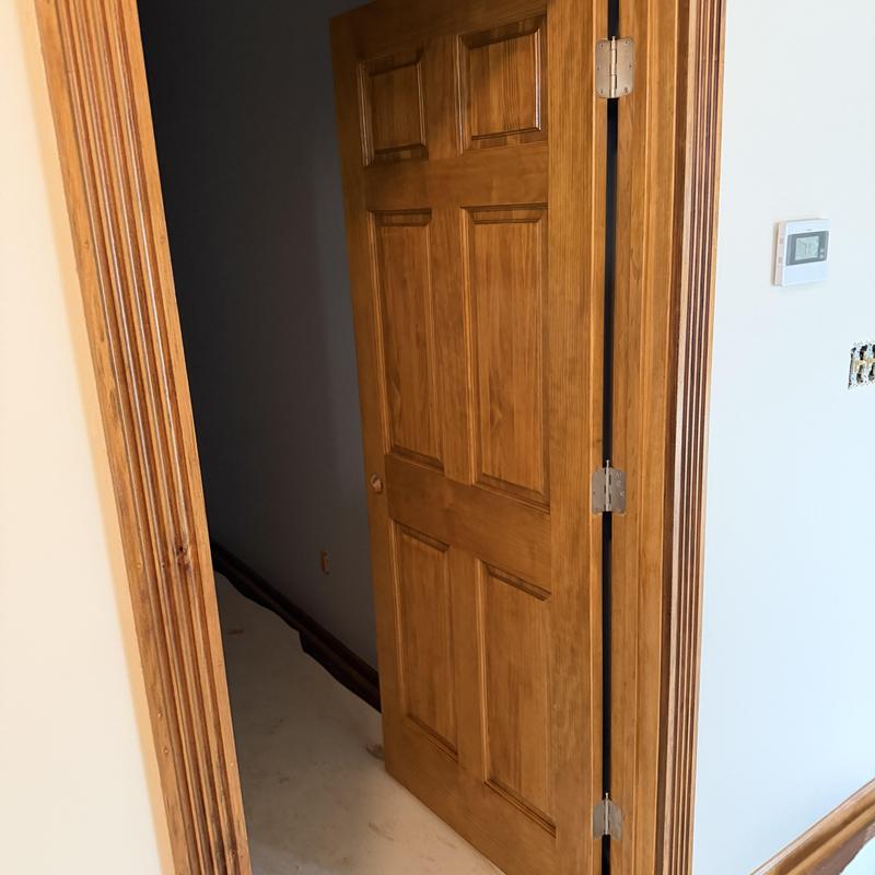 Interior wood door with fresh stain and trim