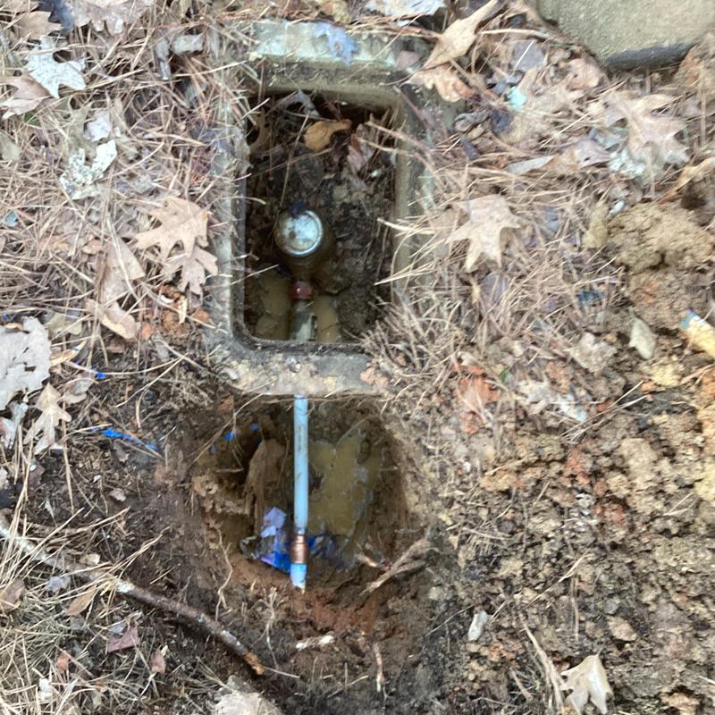 PVC water service pipe and check valve repair in soil