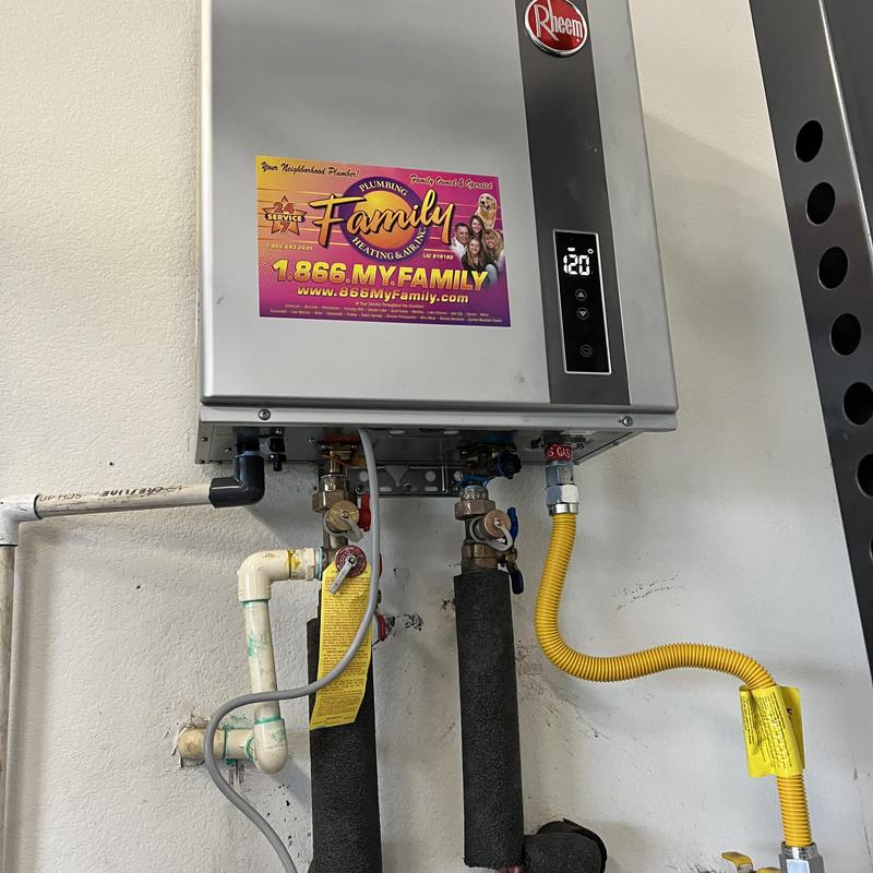 Rheem tankless water heater with piping and valves