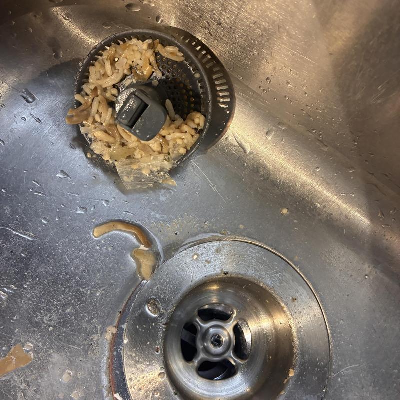 Kitchen sink drain with food debris clog
