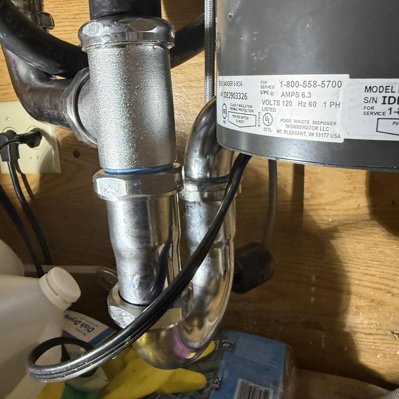 Garbage disposal with P-trap and waste kit installation