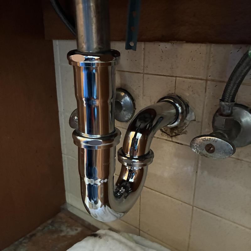 Basin sink chrome P-trap and extension pipe installation