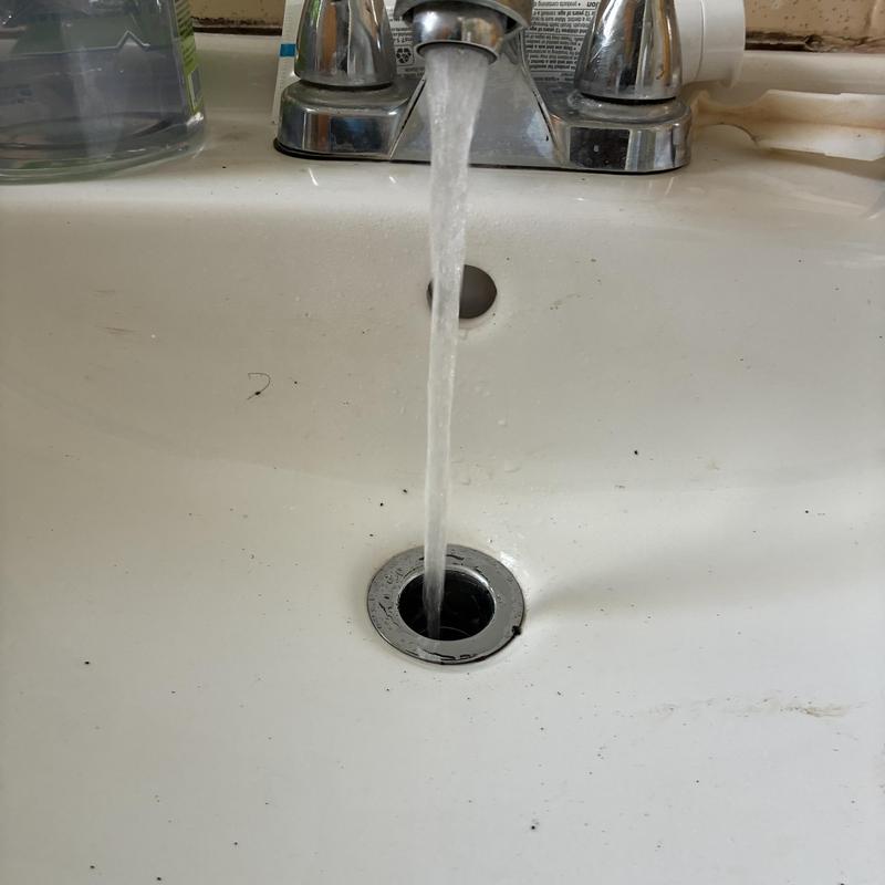Basin sink drain with running water