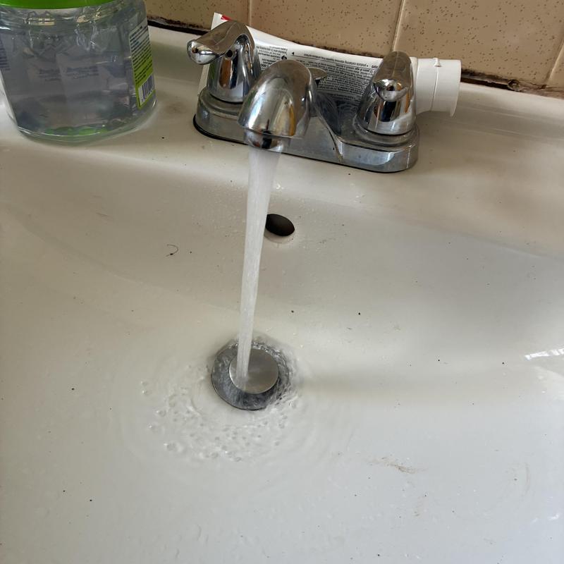 Basin sink drain with running water and faucet