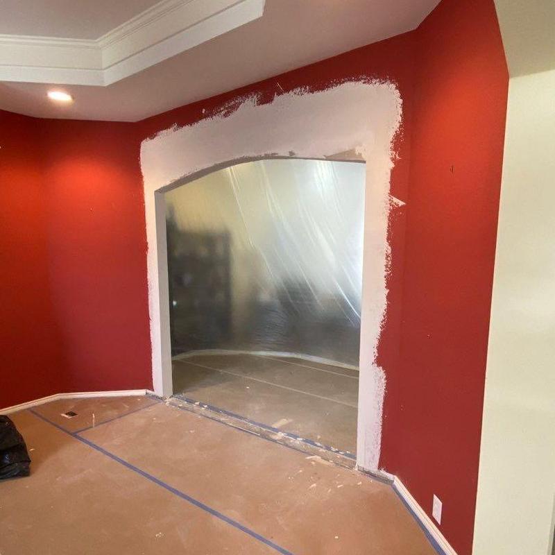 Arched wall opening with drywall and floor prep