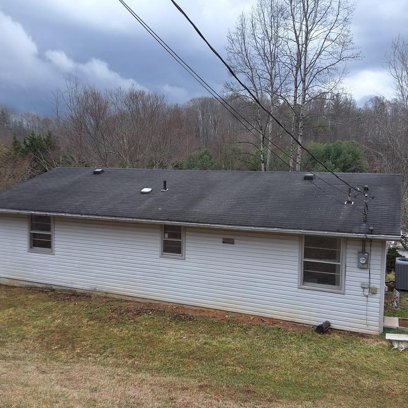 Shingle roof with wind damage and aging in Unicoi TN