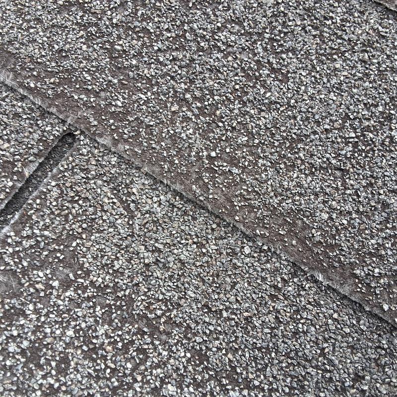 Shingle roof close-up showing wear and granule loss