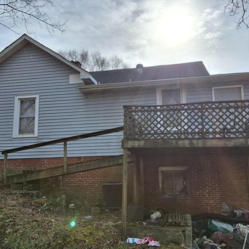 Roof shingles and wooden deck exterior view